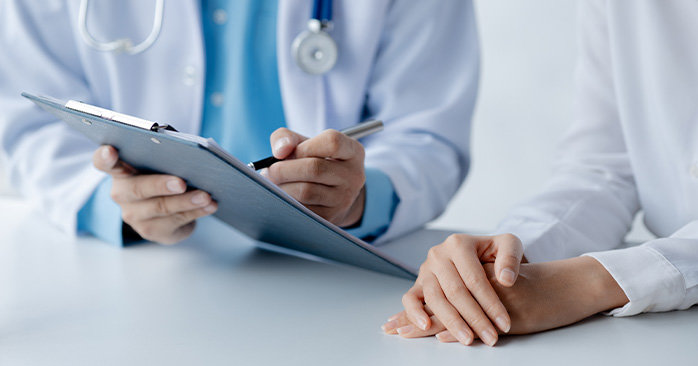 Pharmacist and patient discussing medication